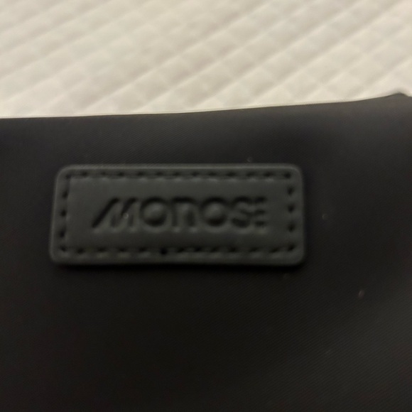 MO35 With a sleek and water-resistant nylon twill with vegan leather details, - Picture 2 of 7